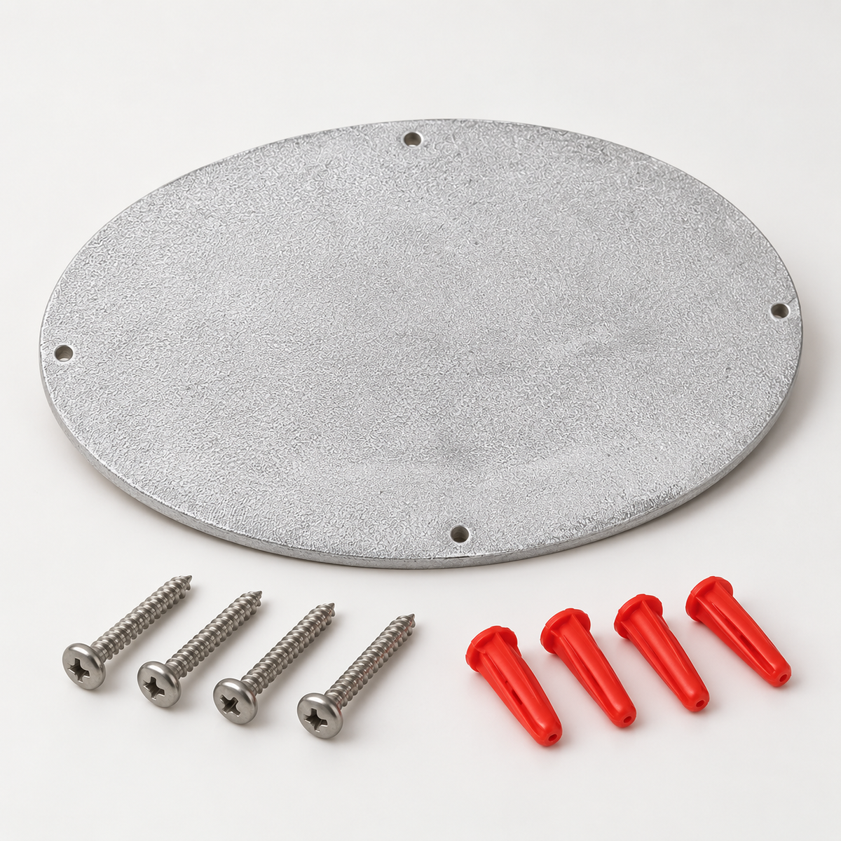Back of oval cast aluminum wall sign with mounting holes, screws, and red wall anchors