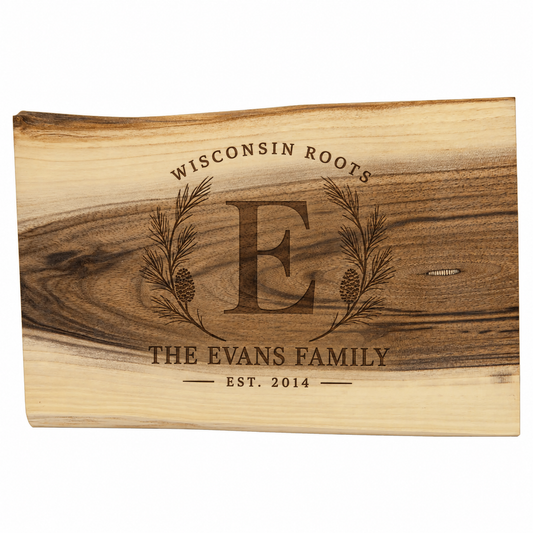 Personalized black walnut cutting board engraved with Wisconsin Roots The Evans Family Est 2014 and a rustic pine branch design.