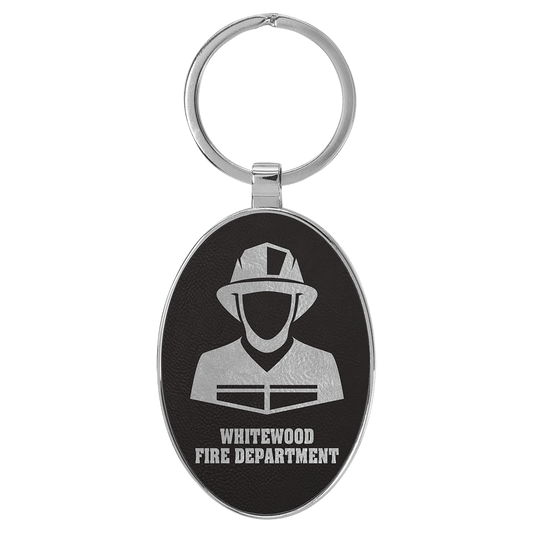 Black/Silver personalized metal-frame oval leatherette keychains with example engraving