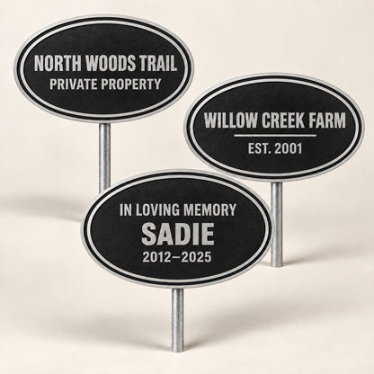 Three personalized oval cast aluminum ground signs for private property, a farm, and a memorial