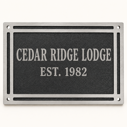 Black rectangular cast aluminum wall plaque personalized for Cedar Ridge Lodge