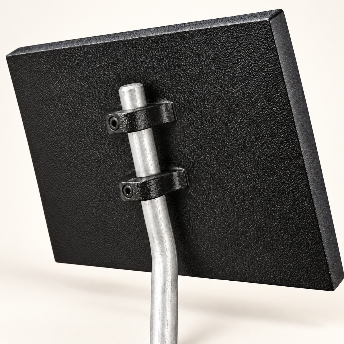 Back of rectangular cast aluminum ground sign showing mounting hardware and stake