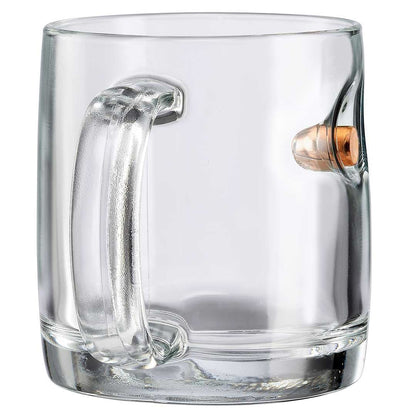 Clear glass mug with a bullet embedment on a white background