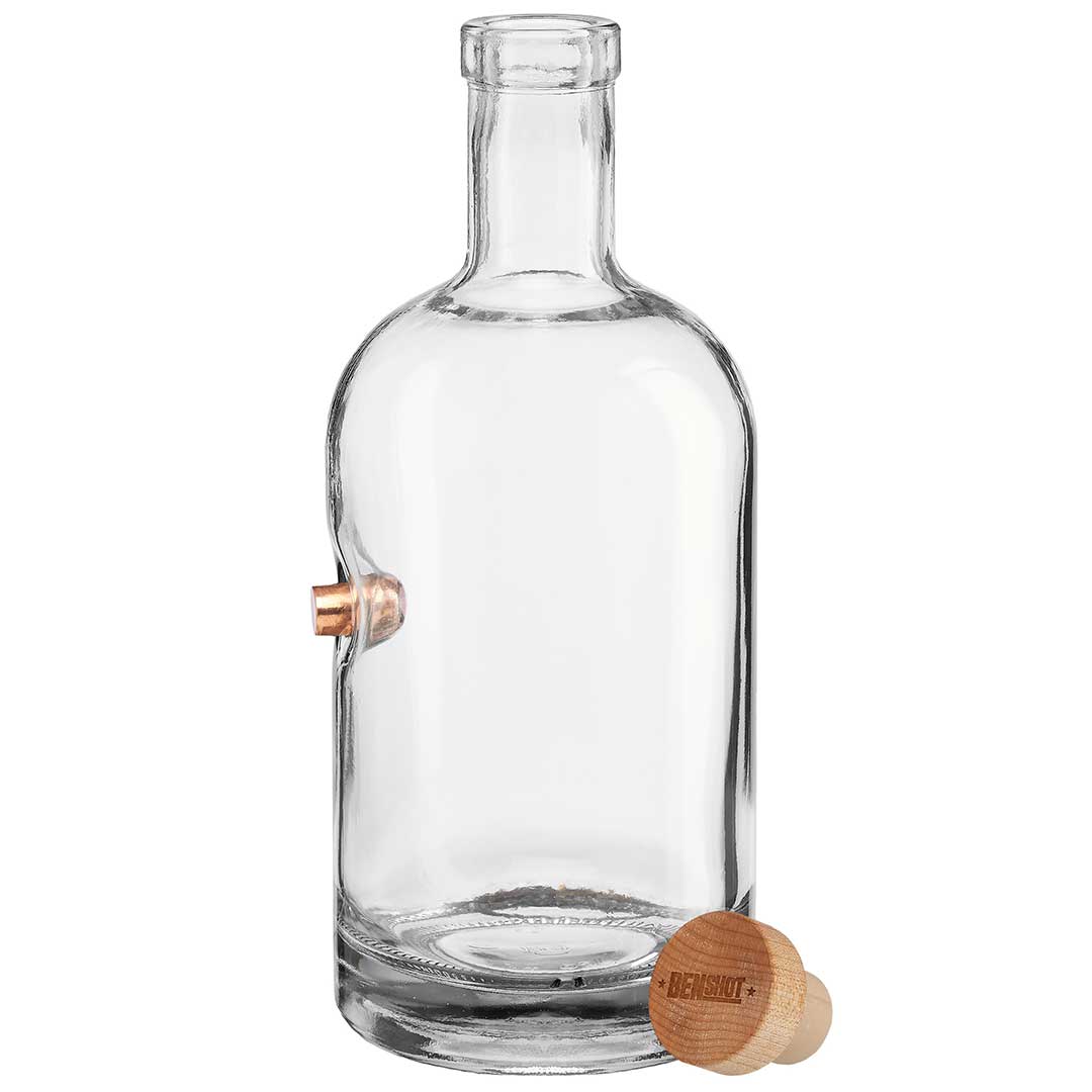 Clear glass bottle with bullet embedment and wooden cap on a white background