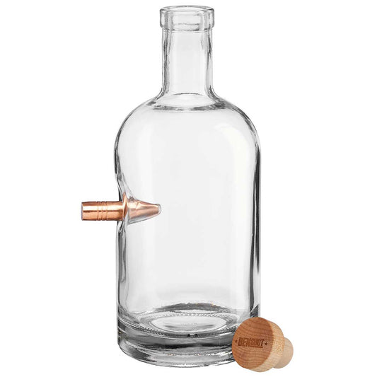 Clear glass bottle with a bullet embedment and wooden cap on a white background