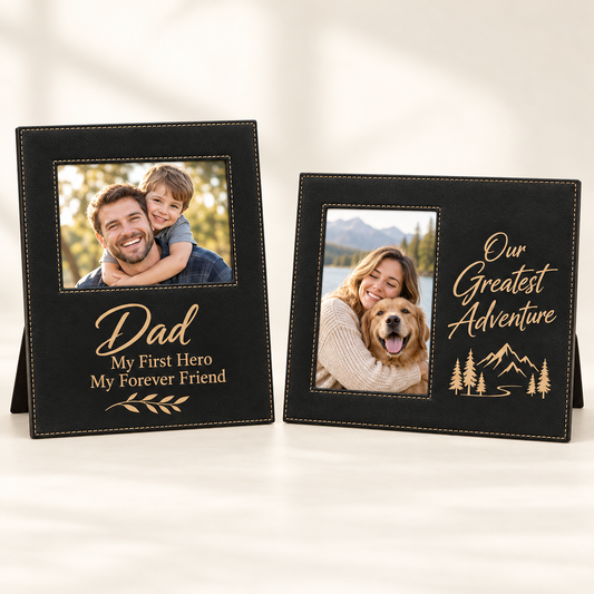 Two black personalized photo frames with stitching and stand bases, displayed on a light background.