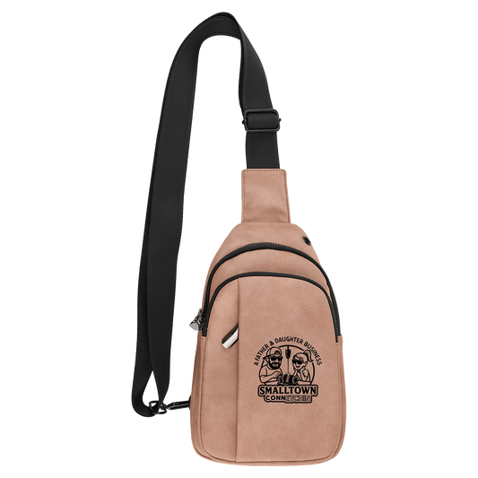 Beige sling bag with black strap on a blank background