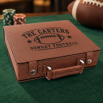 A brown faux-leather poker set with embossed football-themed lettering reading 'THE CARTERS SUNDAY FOOTBALL' sits on a green felt surface. A football is partially visible in the background, along with stacked poker chips.
