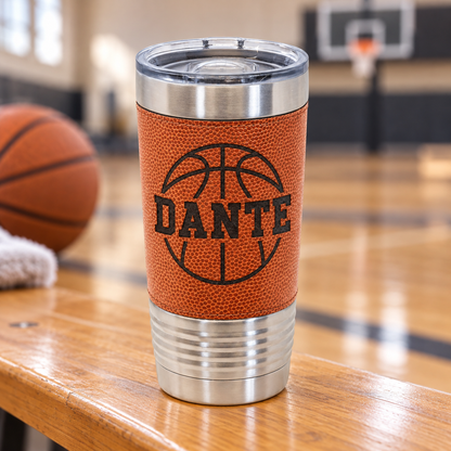 Orange textured basketball-style 20 oz tumbler with black DANTE engraving and clear slider lid.