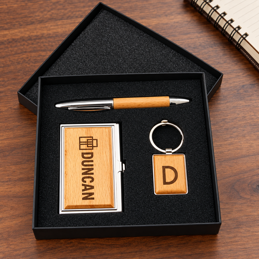 Executive gift set with DUNCAN engraved wood and silver card case, pen and initial keychain in black box.