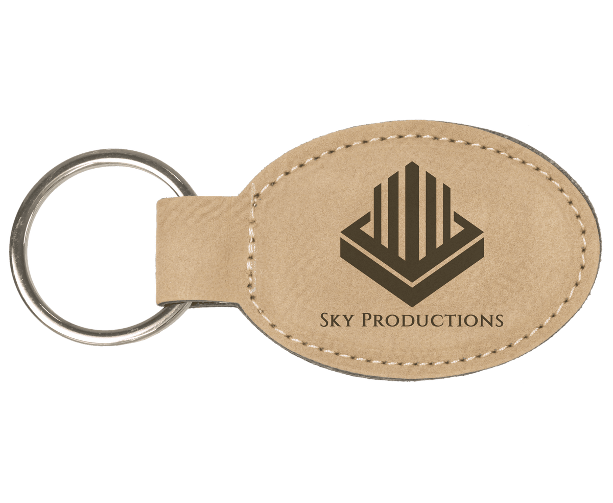 Light Brown personalized oval leatherette keychains with example engraving