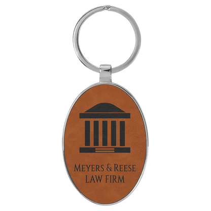 Rawhide personalized metal-frame oval leatherette keychains with example engraving