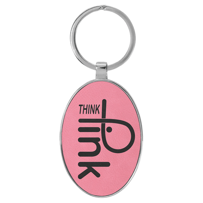 Pink personalized metal-frame oval leatherette keychains with example engraving
