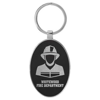 Black/Silver personalized metal-frame oval leatherette keychains with example engraving