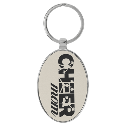 White/Black personalized metal-frame oval leatherette keychains with example engraving