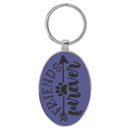 Purple personalized metal-frame oval leatherette keychains with example engraving