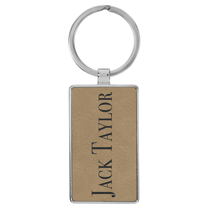 Light Brown personalized metal-frame rectangle leatherette keychains with example engraving