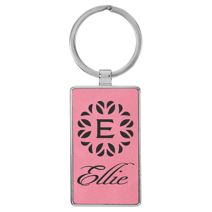 Pink personalized metal-frame rectangle leatherette keychains with example engraving