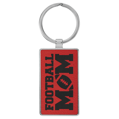 Red personalized metal-frame rectangle leatherette keychains with example engraving