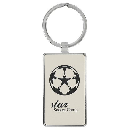 White personalized metal-frame rectangle leatherette keychains with example engraving