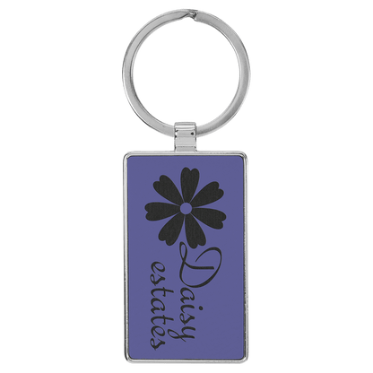 Purple personalized metal-frame rectangle leatherette keychains with example engraving