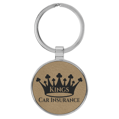 Light Brown personalized metal-frame round leatherette keychains with example engraving