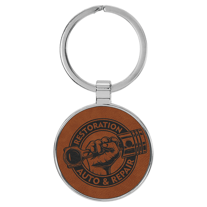 Rawhide personalized metal-frame round leatherette keychains with example engraving