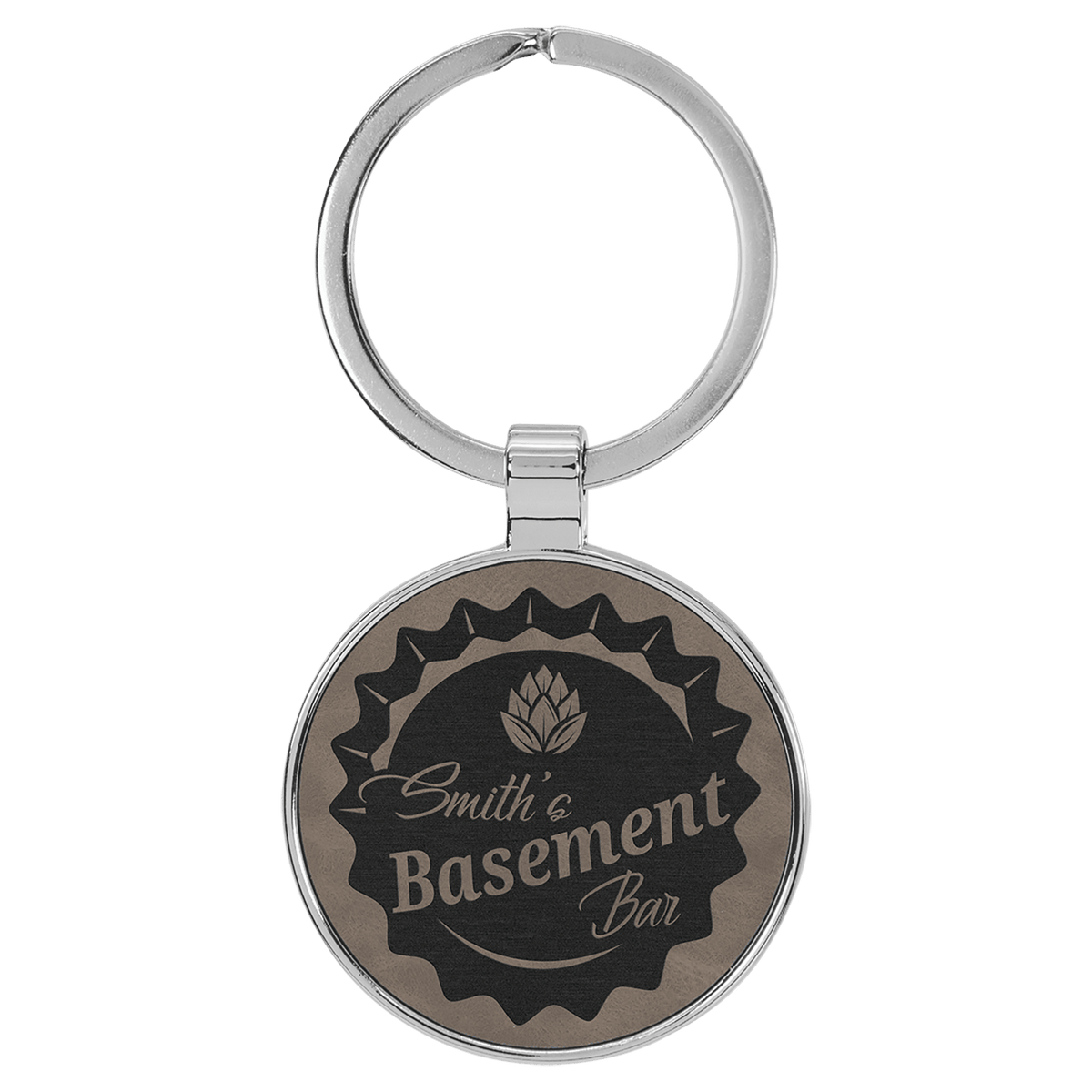 Gray personalized metal-frame round leatherette keychains with example engraving