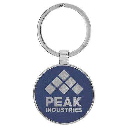 Blue/Silver personalized metal-frame round leatherette keychains with example engraving