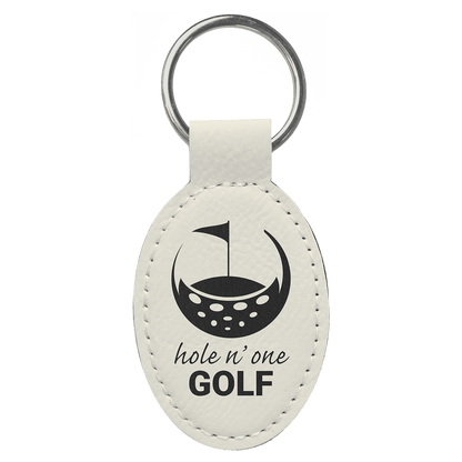 White personalized oval leatherette keychains with example engraving