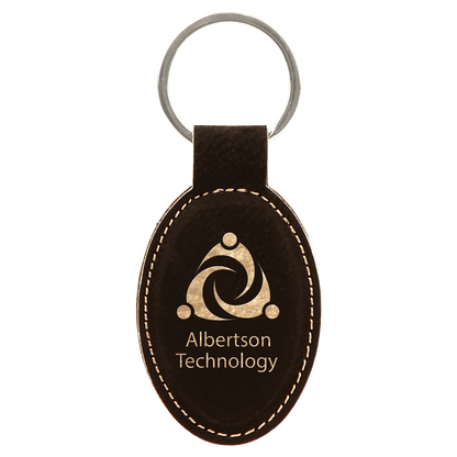 Black/Gold personalized oval leatherette keychains with example engraving