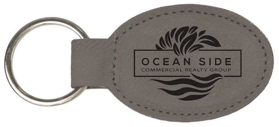 Gray personalized oval leatherette keychains with example engraving