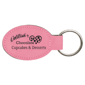Pink personalized oval leatherette keychains with example engraving