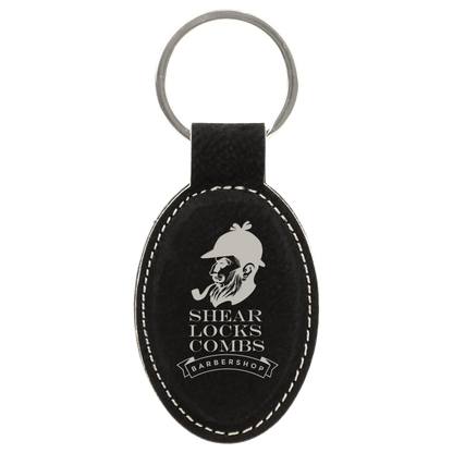 Black/Silver personalized oval leatherette keychains with example engraving