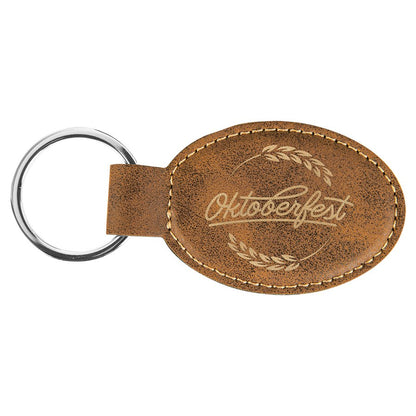 Rustic/Gold personalized oval leatherette keychains with example engraving