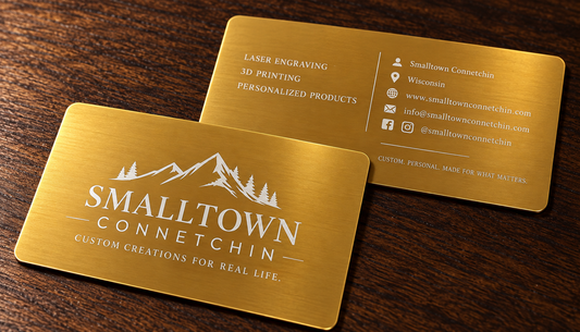 A rectangular gold metal card with rounded corners, engraved with Smalltown Connetchin