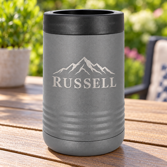 Gray insulated can cooler with silver RUSSELL mountain engraving and black top rim.