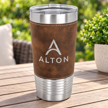 Brown/Silver 20 oz leatherette tumbler with silver ALTON engraving, light stitching and clear lid.