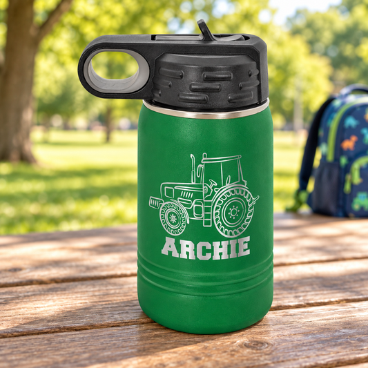 Green 12 oz Polar Camel kids water bottle with black flip-top straw lid and silver ARCHIE tractor engraving.