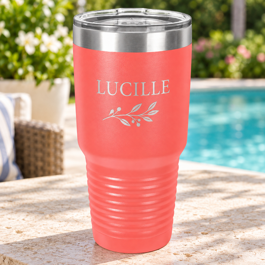 Coral 30 oz ringneck tumbler with silver LUCILLE leaf engraving and clear lid.