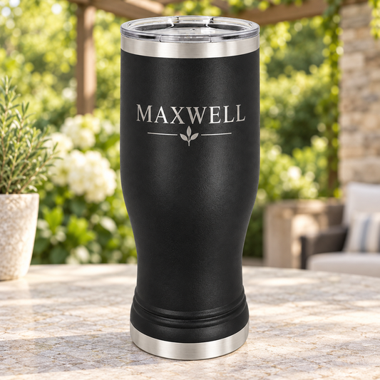 Black 20 oz pilsner tumbler with silver MAXWELL leaf engraving and clear lid.