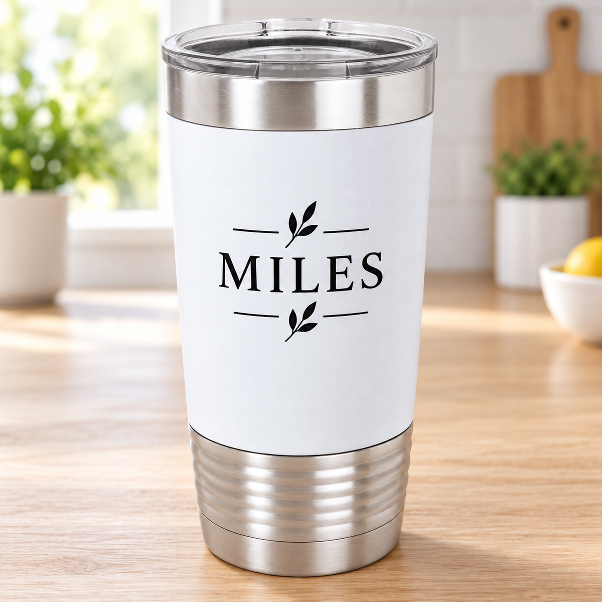 White 20 oz silicone-grip tumbler with black MILES engraving, silver ringed base and clear lid.
