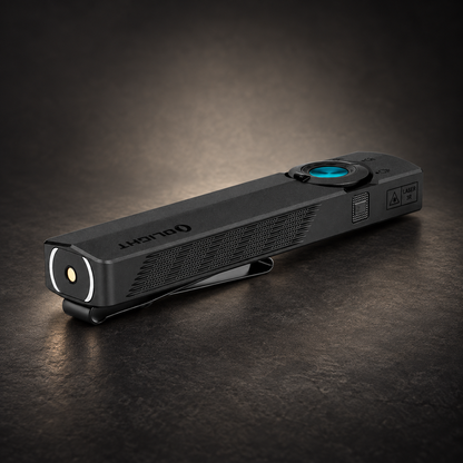 Black Olight ArkPro flashlight with a textured grip, side controls, and a round front lens resting on a dark surface