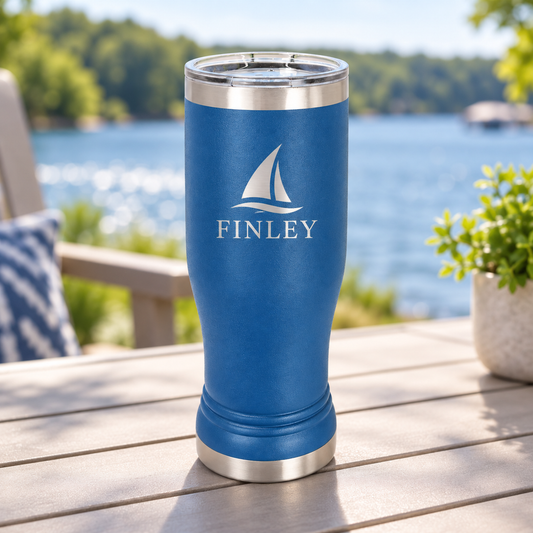 Royal Blue 14 oz pilsner tumbler with silver FINLEY sailboat engraving and clear lid.