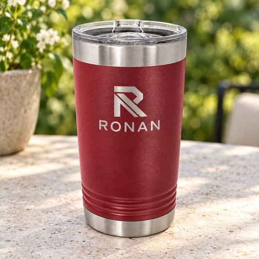 Maroon 16 oz pint tumbler with silver RONAN monogram engraving and clear slider lid.