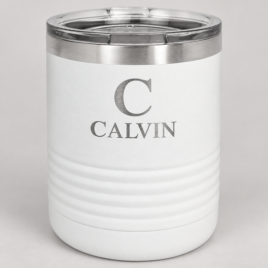 White 10 oz ringneck tumbler with silver CALVIN monogram engraving and clear lid.