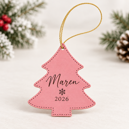 Pink tree-shaped leatherette ornament engraved with Maren and 2026