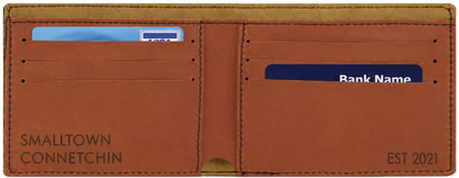 A brown leather bifold wallet shown open, with card slots and a cash pocket. The left side is printed with 'SMALLTOWN CONNETCHIN' and the right side is printed with 'EST 2021'.