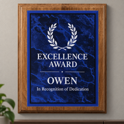 An acrylic plated custom award plaque featuring a blue marble plate with a white laurel wreath and the text 'EXCELLENCE AWARD OWEN In Recognition of Dedication'.